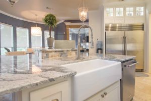Modern Blu Kitchen Remodel in Grapevine with large farm sink