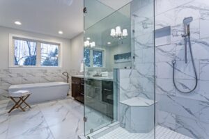 Marble Flooring with Glass Shower door and luxury bathtub in Bathroom Remodel in Highland Village