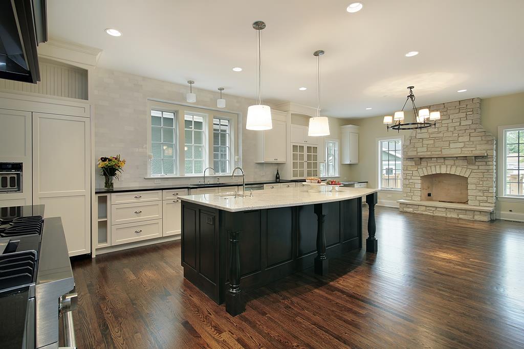 Kitchen and family room with stone fireplace