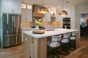 Kitchen remodel with lighting, quartz countertops, accent lighting, kitchen island