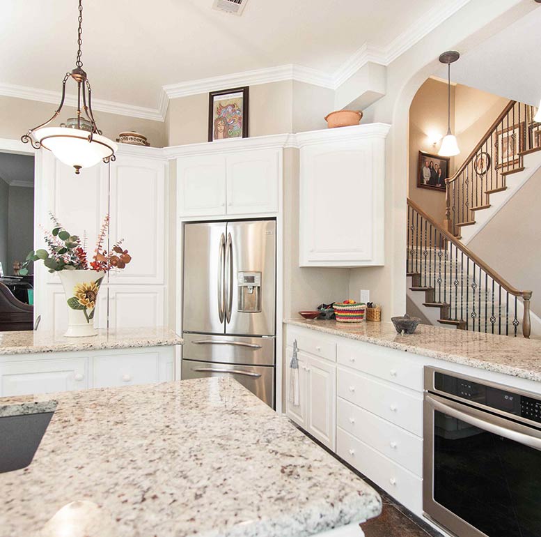 Highland Village Kitchen remodel Highland Village kitchen remodel with white granite countertops, sub zero fridge, stainless appliances